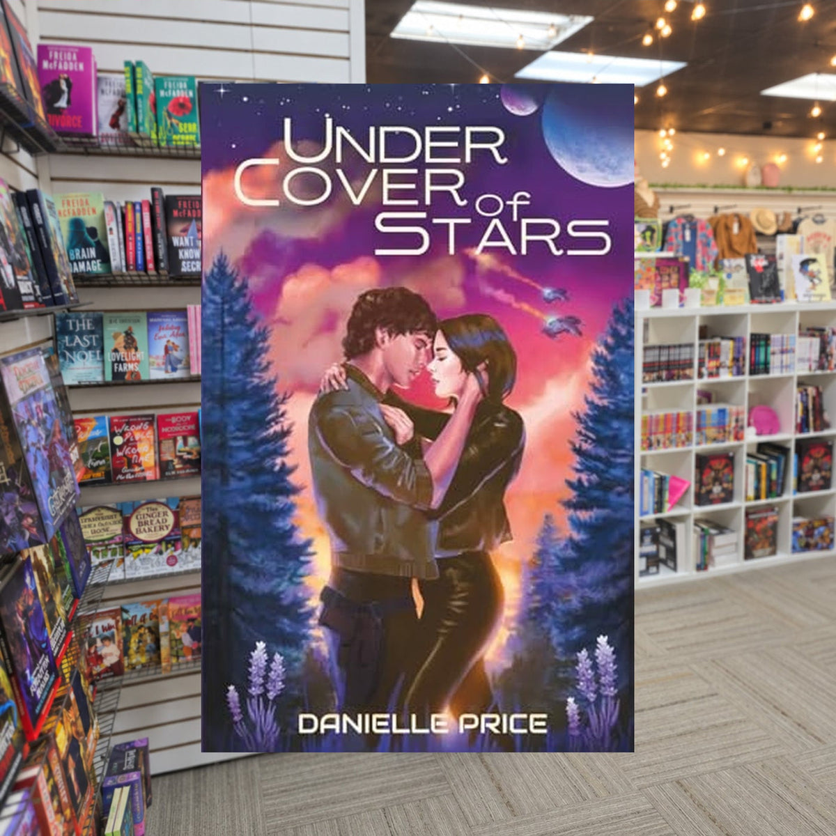 Under Cover of Stars by Danielle Price — actual cover on The Perk bookstore background