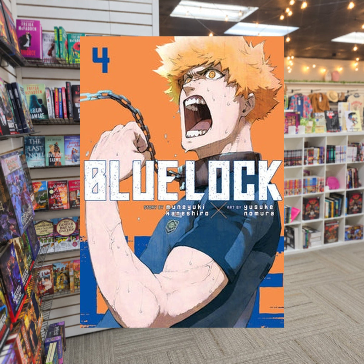 Blue Lock, Vol. 4 by Muneyuki Kaneshiro — actual cover on The Perk bookstore background