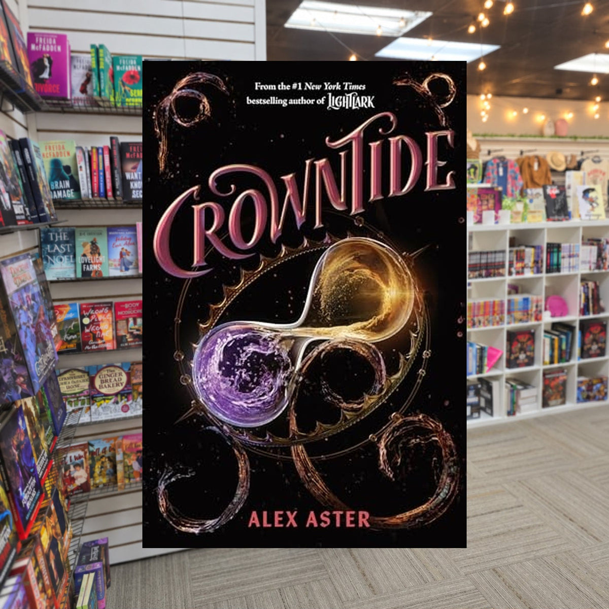Crowntide by Alex Aster — actual cover on The Perk bookstore background