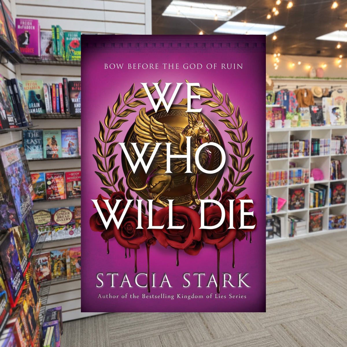 We Who Will Die By Stacia Stark — actual cover on The Perk bookstore background
