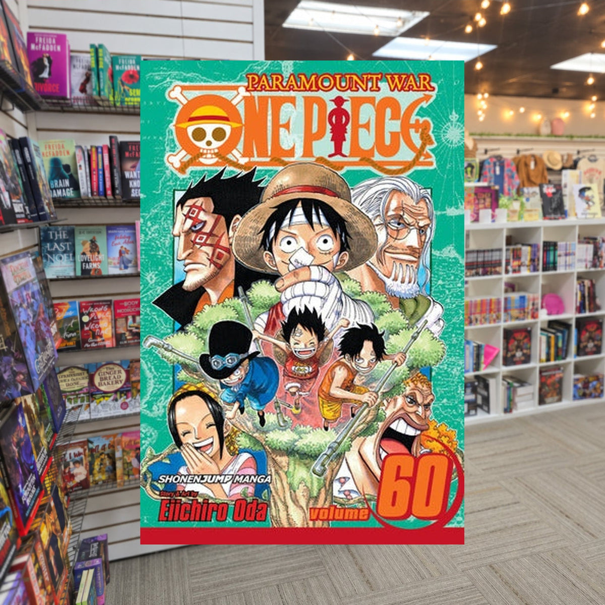 One Piece, Volume 60: My Little Brother by Eiichiro Oda — actual cover on The Perk bookstore background