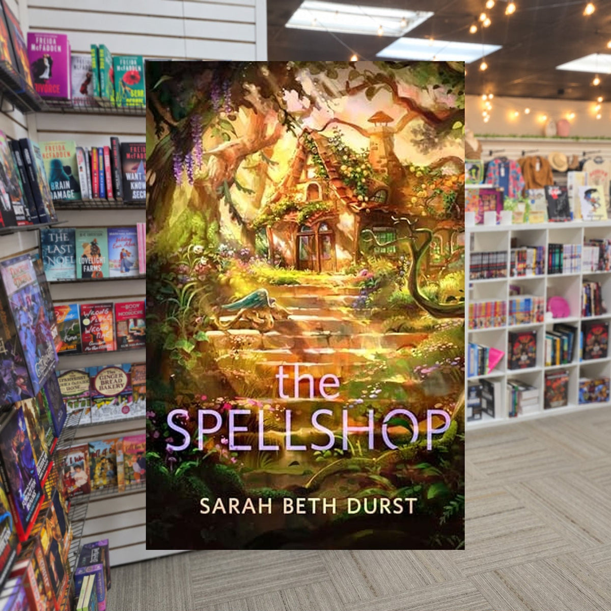 The Spellshop by Sarah Beth Durst — actual cover on The Perk bookstore background