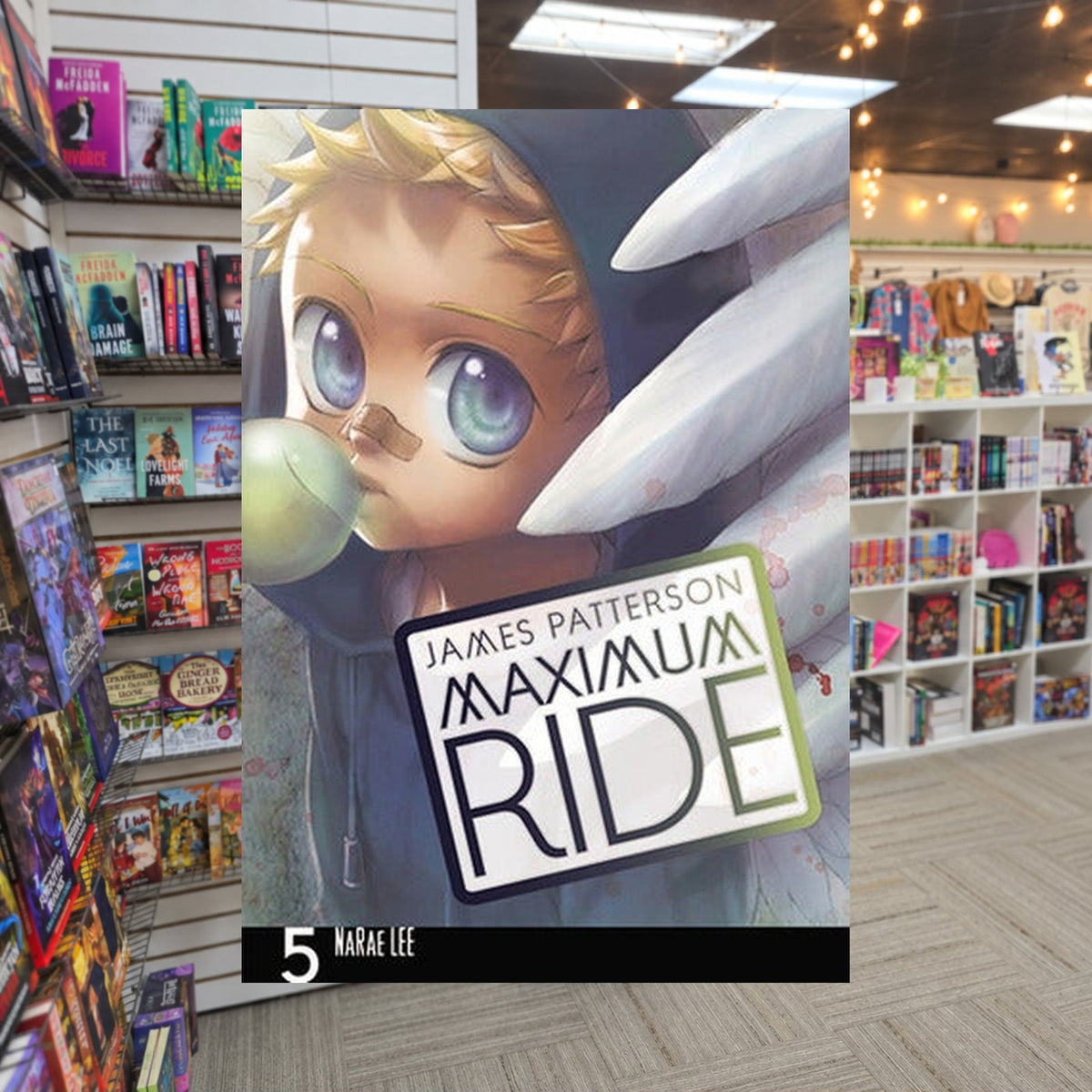 Maximum Ride, Vol. 5 by NaRae Lee — actual cover on The Perk bookstore background