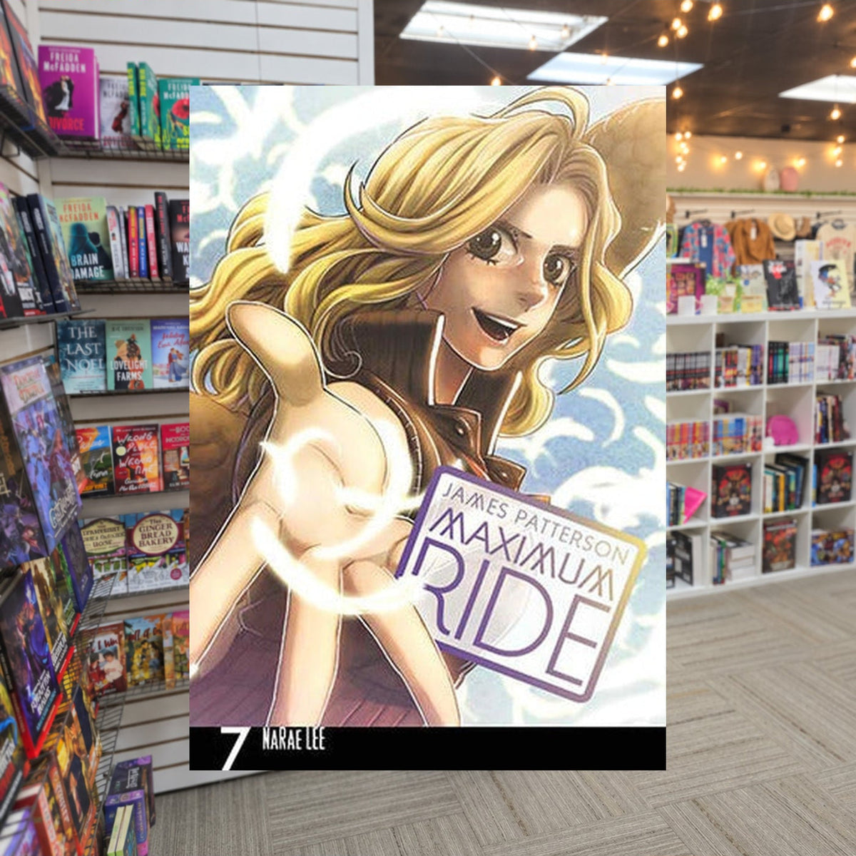 Maximum Ride, Vol. 7 by NaRae Lee — actual cover on The Perk bookstore background