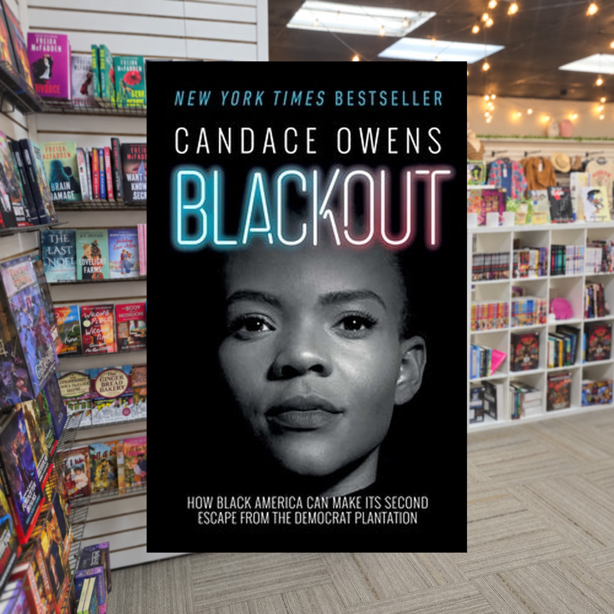 Blackout: How Black America Can Make Its Second Escape from the Democrat Plantation by Candace Owens — actual cover on The Perk bookstore background