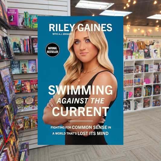 Swimming Against the Current: Fighting for Common Sense in a World That's Lost its Mind by Riley Gaines — actual cover on The Perk bookstore background
