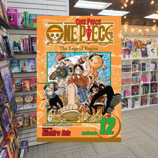 One Piece, Volume 12: The Legend Begins by Eiichiro Oda — actual cover on The Perk bookstore background