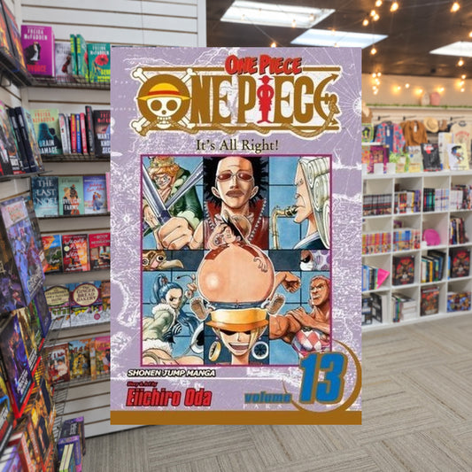 One Piece, Volume 13: It's All Right! by Eiichiro Oda — actual cover on The Perk bookstore background
