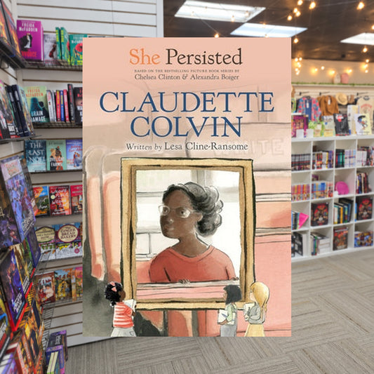 She Persisted: Claudette Colvin By Lesa Cline-Ransome — actual cover on The Perk bookstore background