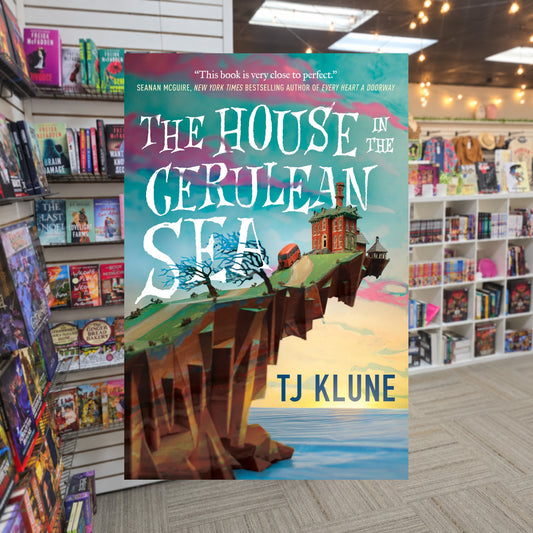 The House in the Cerulean Sea by T.J. Klune — actual cover on The Perk bookstore background