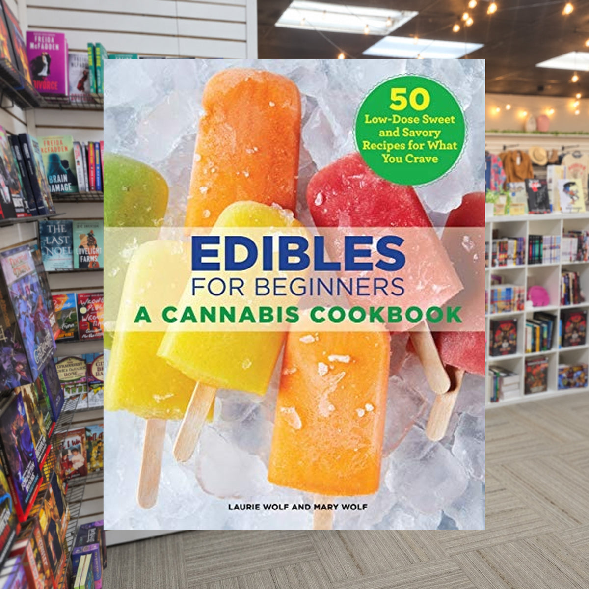 Edibles for Beginners: A Cannabis Cookbook by Laurie Wolf & Mary Wolf — actual cover on The Perk bookstore background