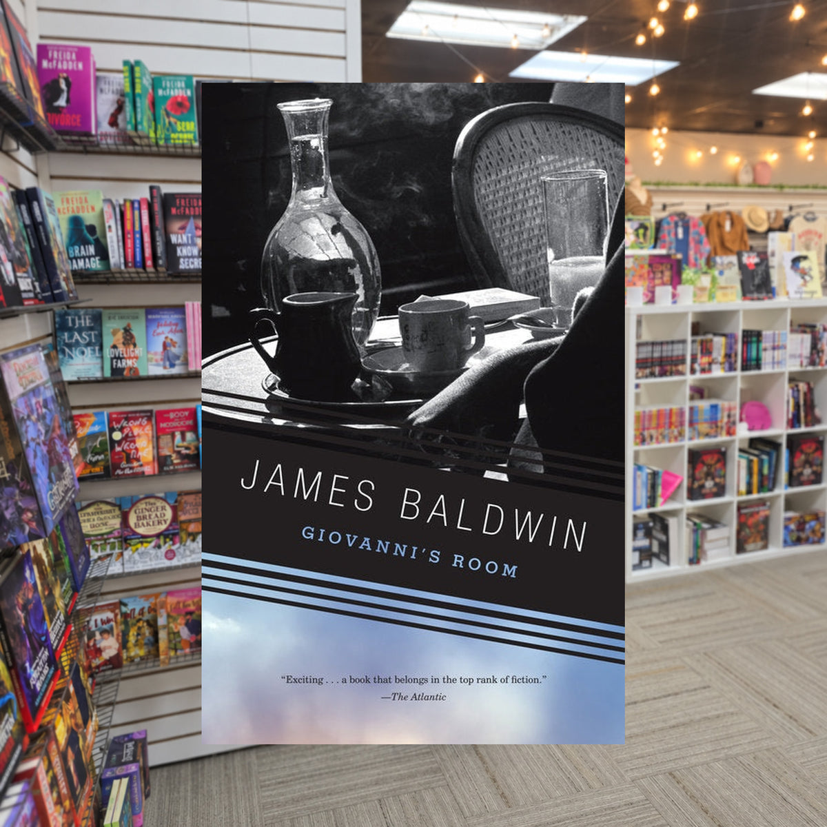 Giovanni’s Room by James Baldwin — actual cover on The Perk bookstore background