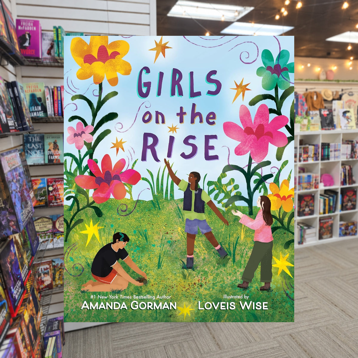 Girls on the Rise by Amanda Gorman — actual cover on The Perk bookstore background