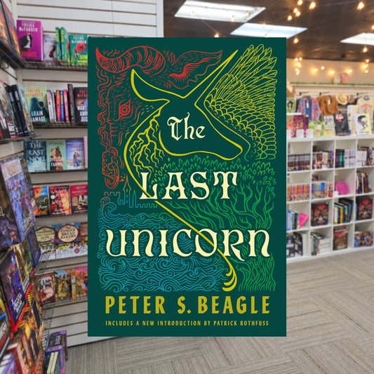 The Last Unicorn by Peter S. Beagle — actual cover on The Perk bookstore background