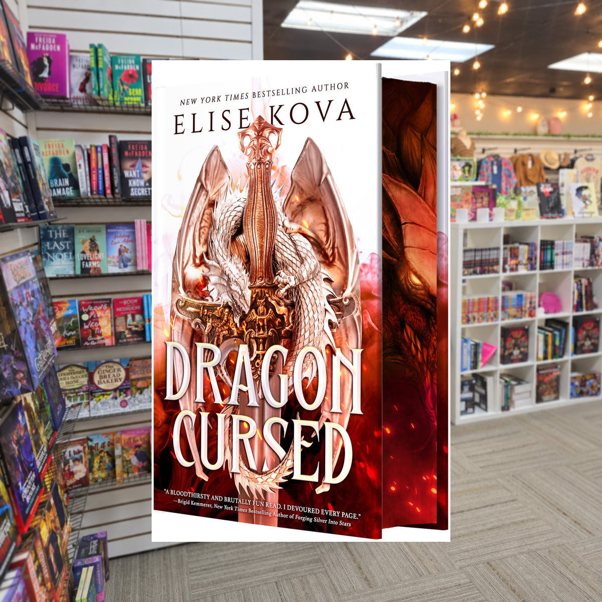 Dragon Cursed by Elise Kova — actual cover on The Perk bookstore background