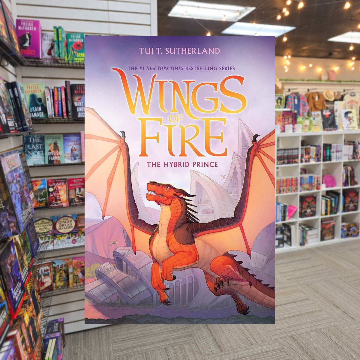 The Hybrid Prince (Wings of Fire, book 16) by Tui T. Sutherland — actual cover on The Perk bookstore background