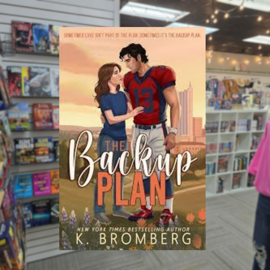 The Backup Plan by K. Bromberg paperback sports romance book cover featuring an illustrated football quarterback in a red jersey standing beside a woman against a stadium backdrop.