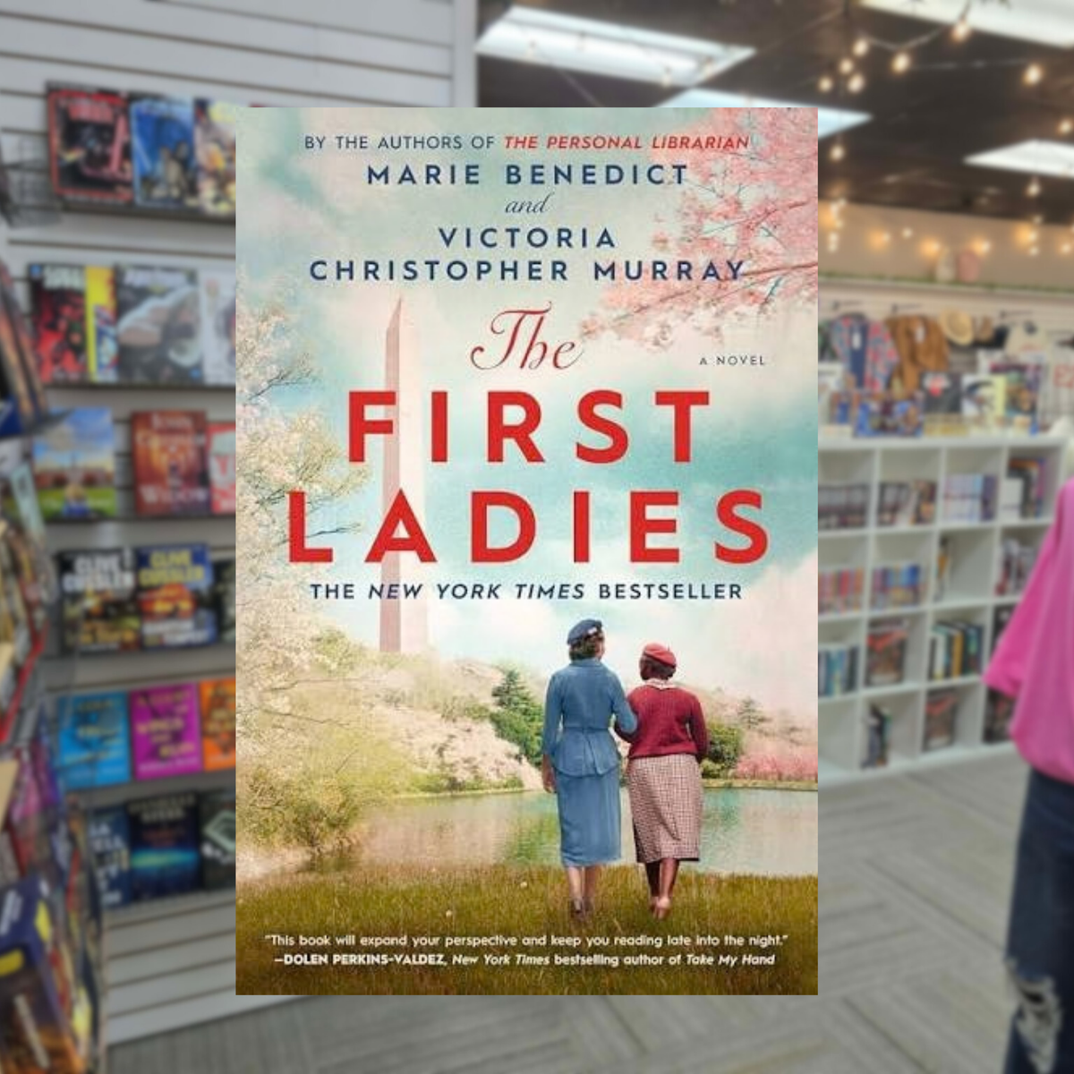 The First Ladies by Marie Benedict and Victoria Christopher Murray historical fiction paperback featuring Eleanor Roosevelt and Mary McLeod Bethune walking together beside a lake with the Washington Monument in the background