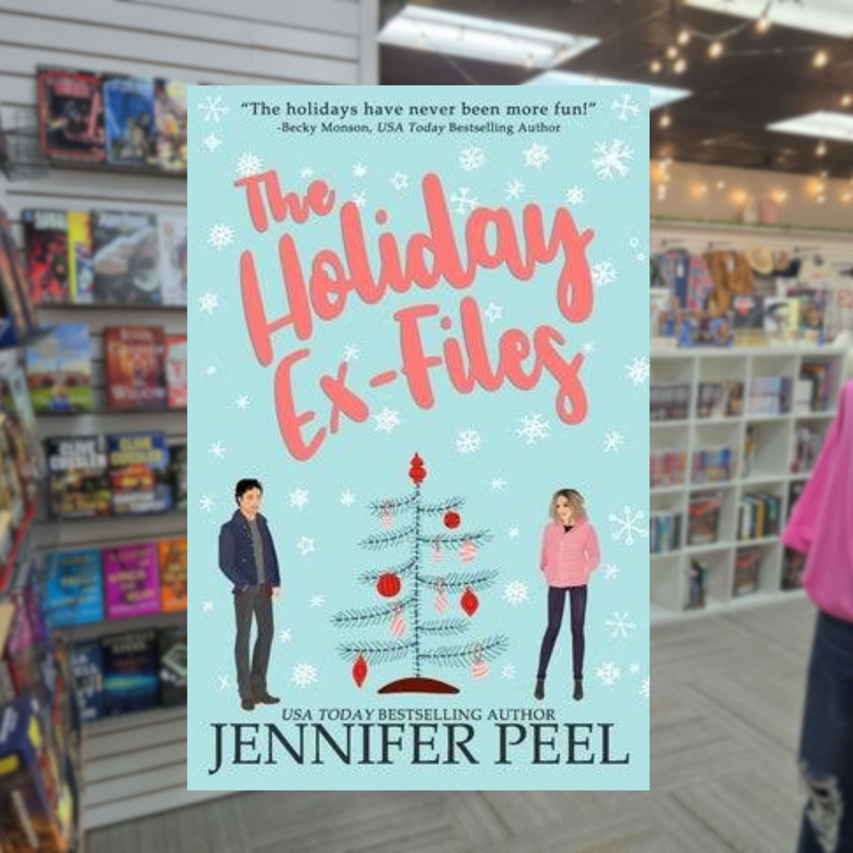 The Holiday Ex-Files by Jennifer Peel Christmas romance book cover featuring a light blue background, falling snowflakes, a decorated Christmas tree, and an illustrated man and woman.