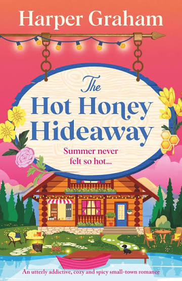 The Hot Honey Hideaway by Harper Graham spicy small-town romance paperback cover featuring a cozy lakeside log cabin café, colorful flowers, honeycomb details, string lights, and a vibrant pink and orange summer sunset.