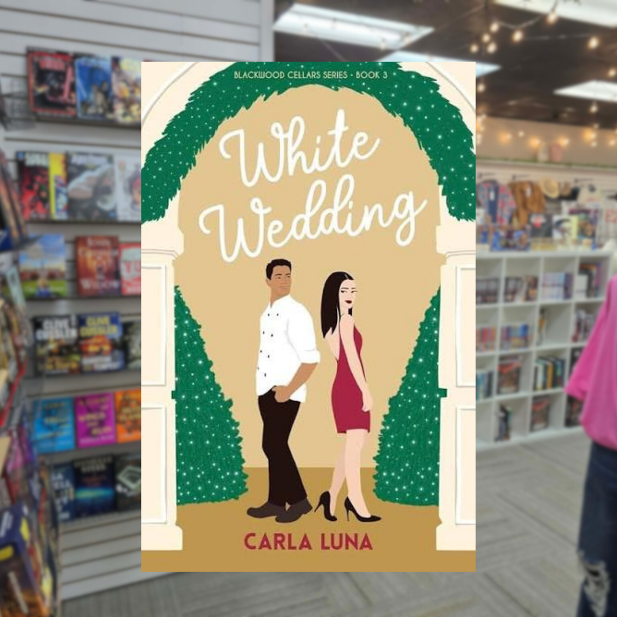 White Wedding by Carla Luna, Blackwood Cellars Book 3, romance book cover featuring an illustrated man in a white shirt and a woman in a red dress standing beneath a greenery-covered wedding arch.
